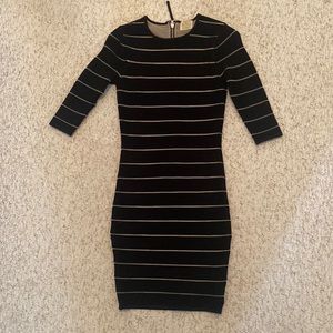 Bodycon black mini dress with mesh cutouts